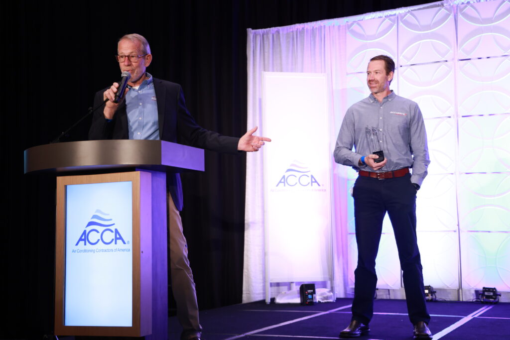 Tom White and son Brian White accept Commercial Contractor of the Year award on behalf of Accurate Mechanical