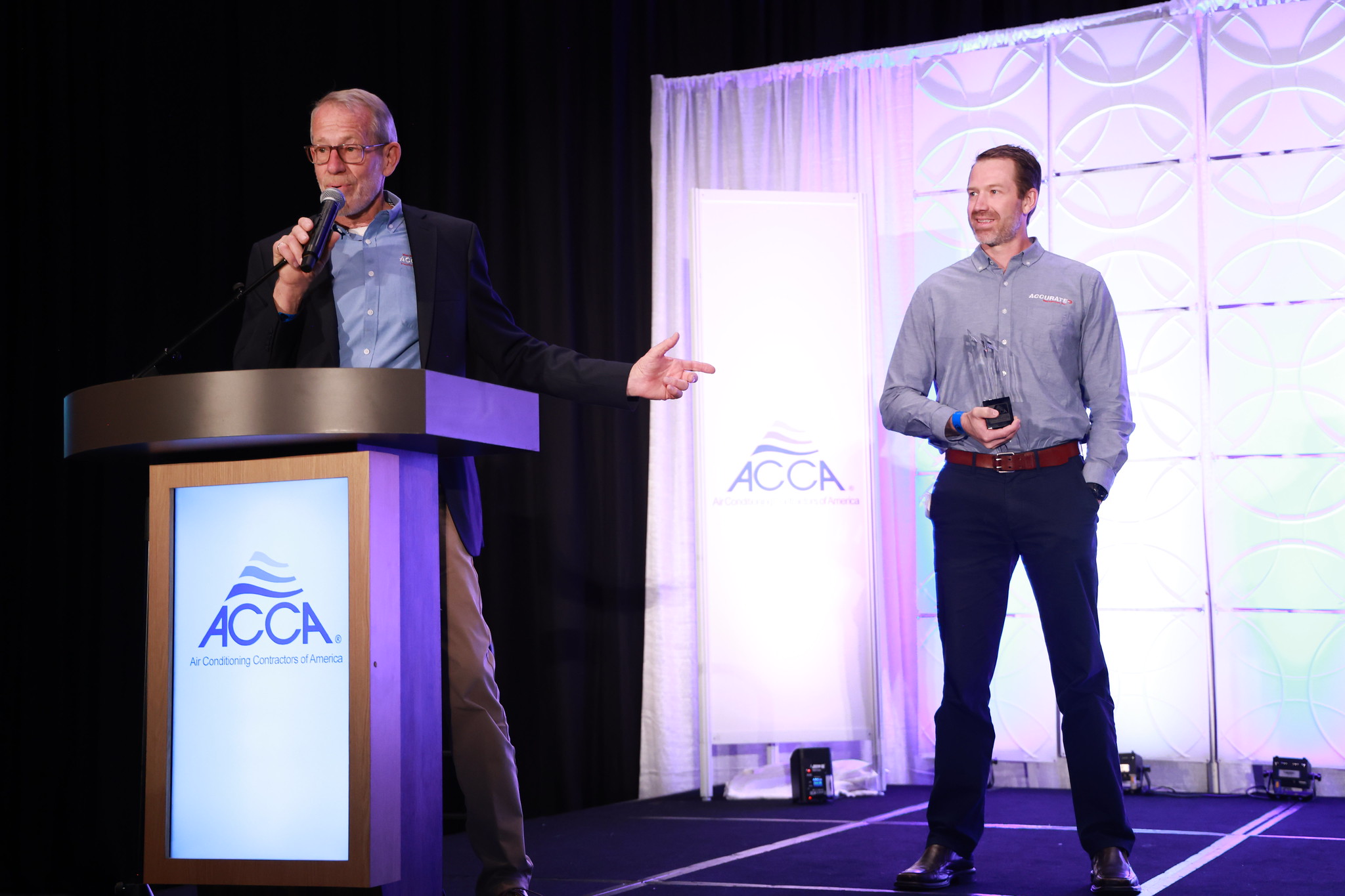 Tom White and son Brian accept the 2025 Commercial Contractor of the Year Award at ACCA 2025 in Austin, Texas.